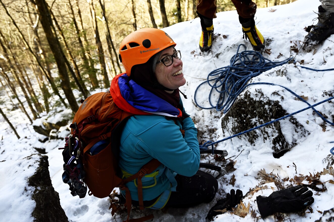 Rock climber Paige Cox, vice president of the Ragged Mountain Foundation in Southington, is all smiles after making a final pull to conquer an ice flow on Jan. 21, 2020.
